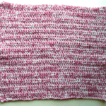 pink and white knitted square